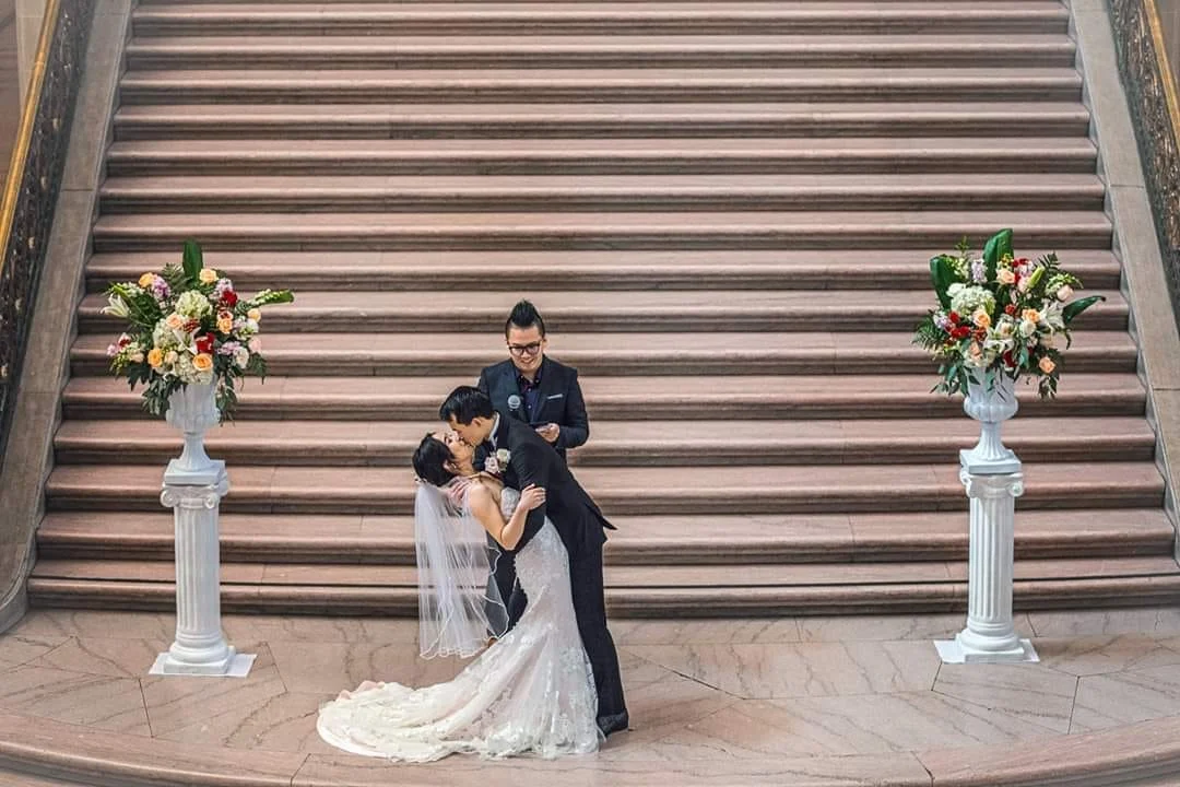 Bilingual Cantonese and English wedding emcee and officiant at a ceremony on the grand staircase of San Francisco City Hall